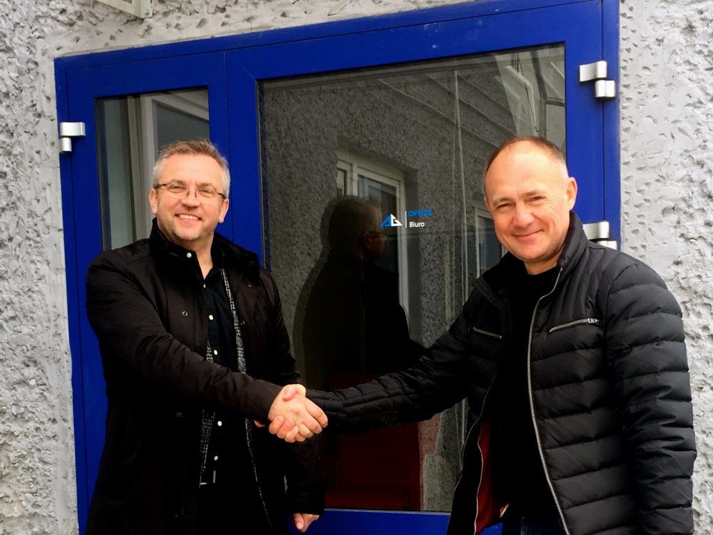 Partner business handshake / Piotr Wcisłek and Alexander Strizhak